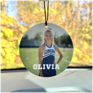 Custom photo air freshener hanging from a mirror