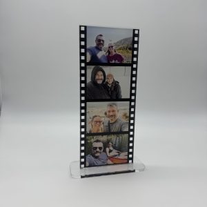 A photo of 4 photos in a acrylic photo film strip